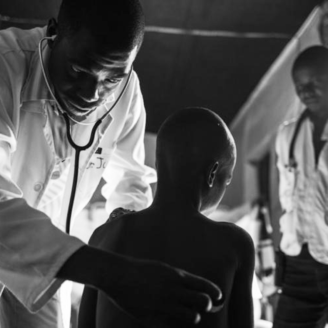 Doctor helping patient